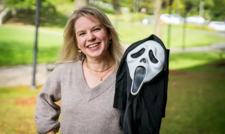 Dr. Elizabeth Cohen holding a Ghost Face mask outside of WVU's Field Hall on October 12, 2026. (WVU Photo/Jalyn Lamp)
